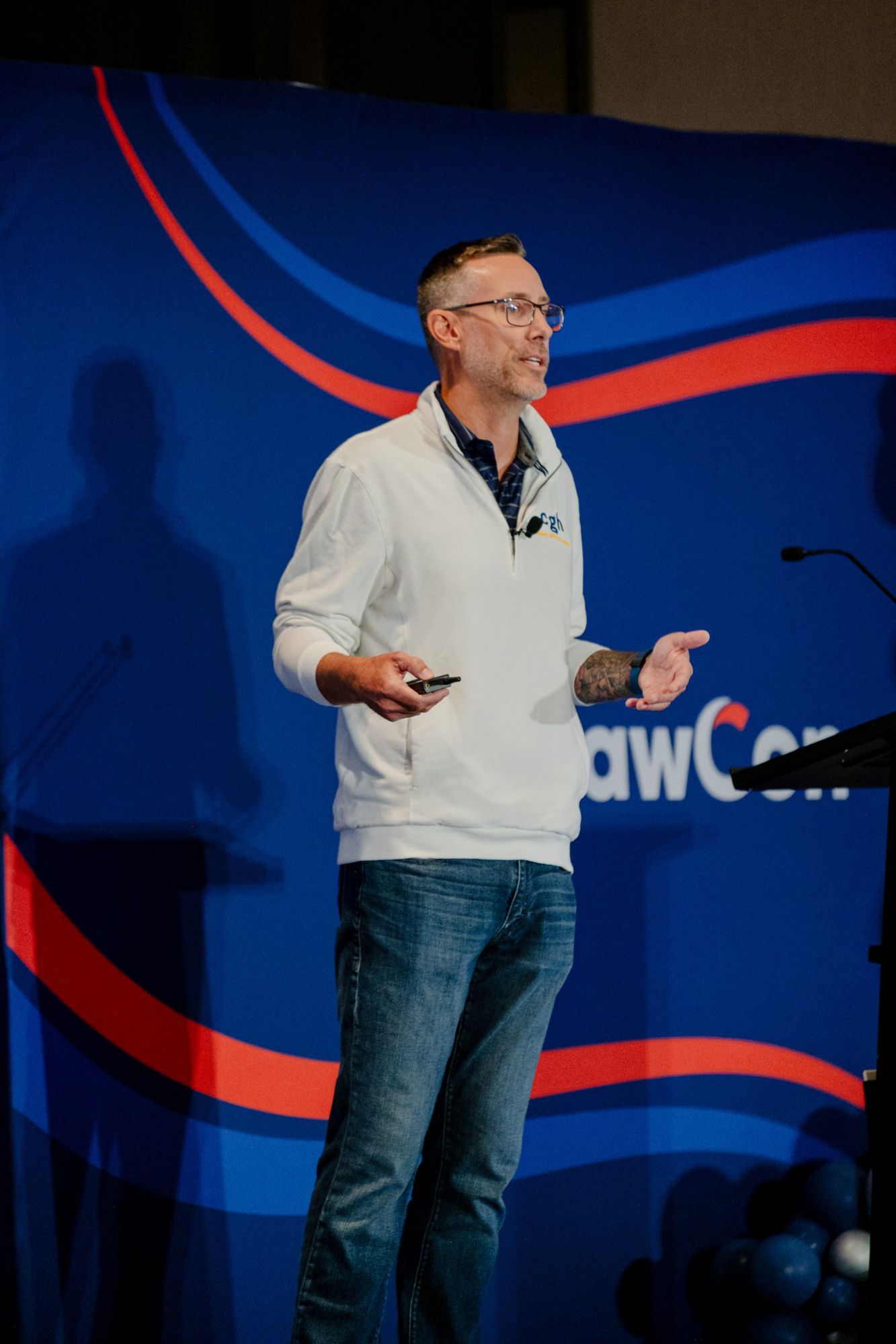 Travis on stage at MaxLawCon in 2026